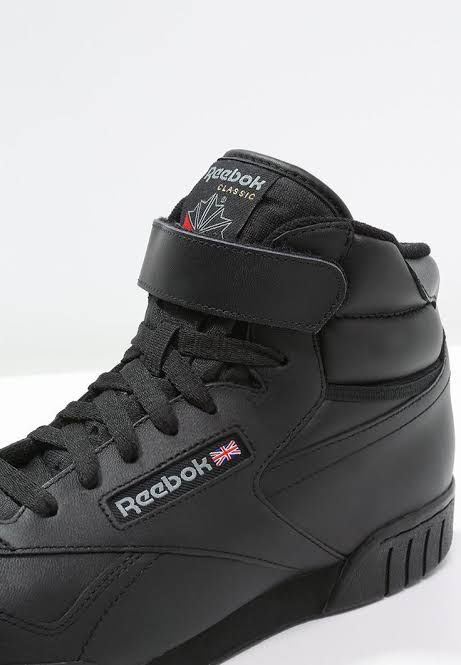 Tenis Reebok Ex-O-Fit de cuero negro con diseño retro y ajuste cómodo, ideales para estilo casual.