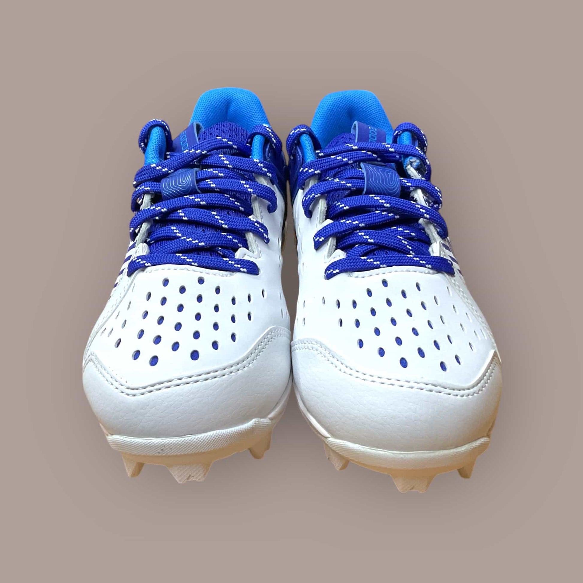 Botines de béisbol y fútbol UA Leadoff Low RM Jr azul y blanco para jóvenes jugadores