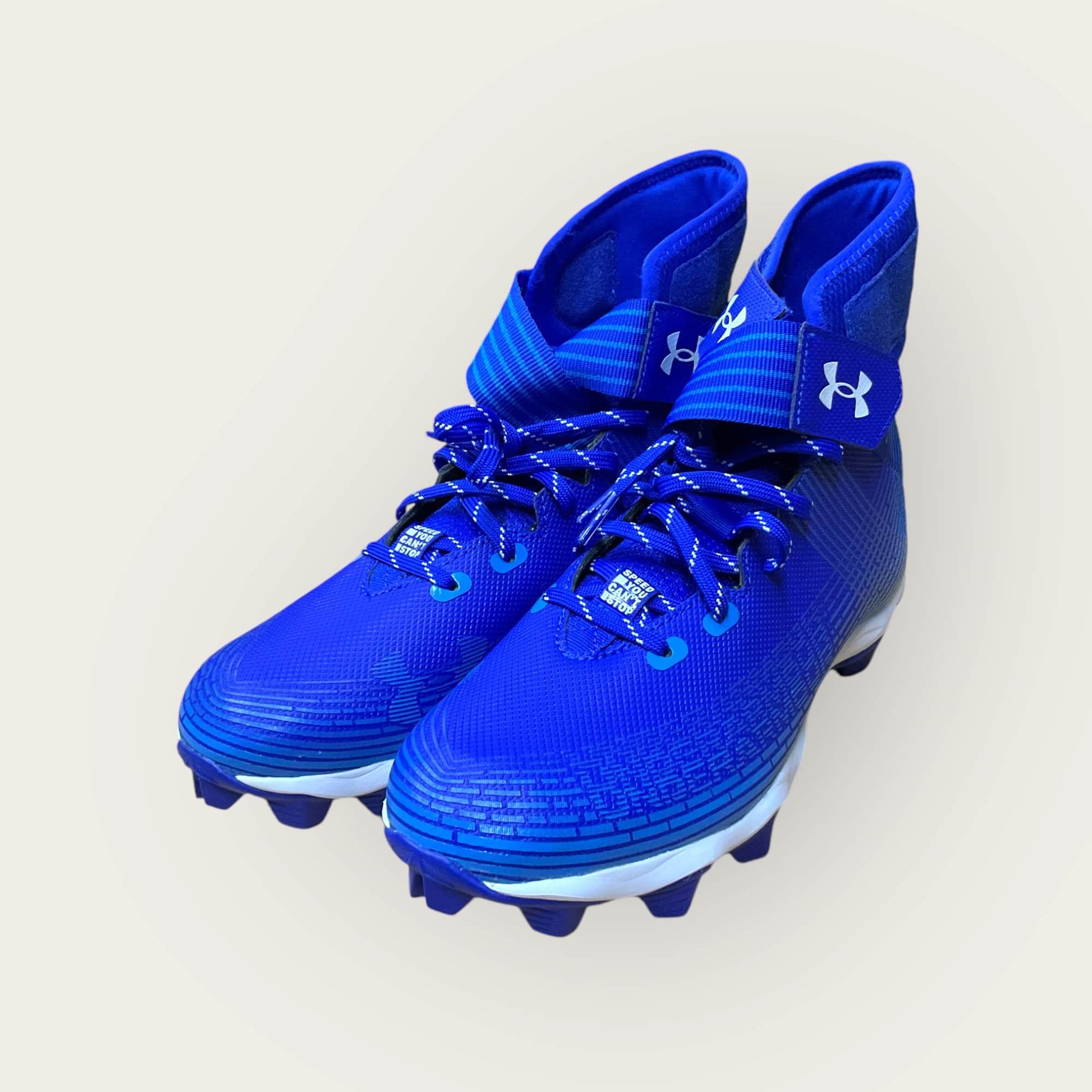 Zapatillas UA Highlight Franchise Azul con tecnología ClutchFit para fútbol y béisbol, en color azul.