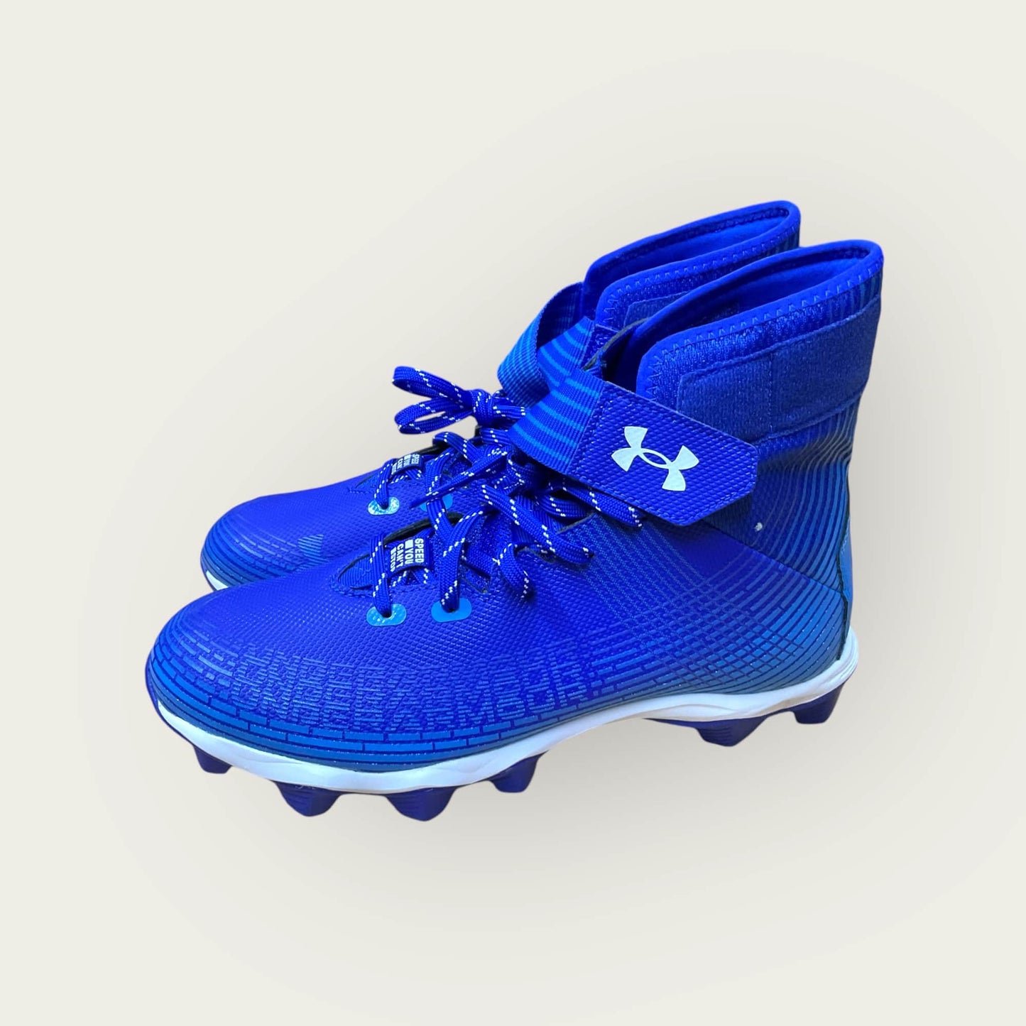Zapatillas UA Highlight Franchise Azul con tecnología ClutchFit para fútbol y béisbol, en color azul.