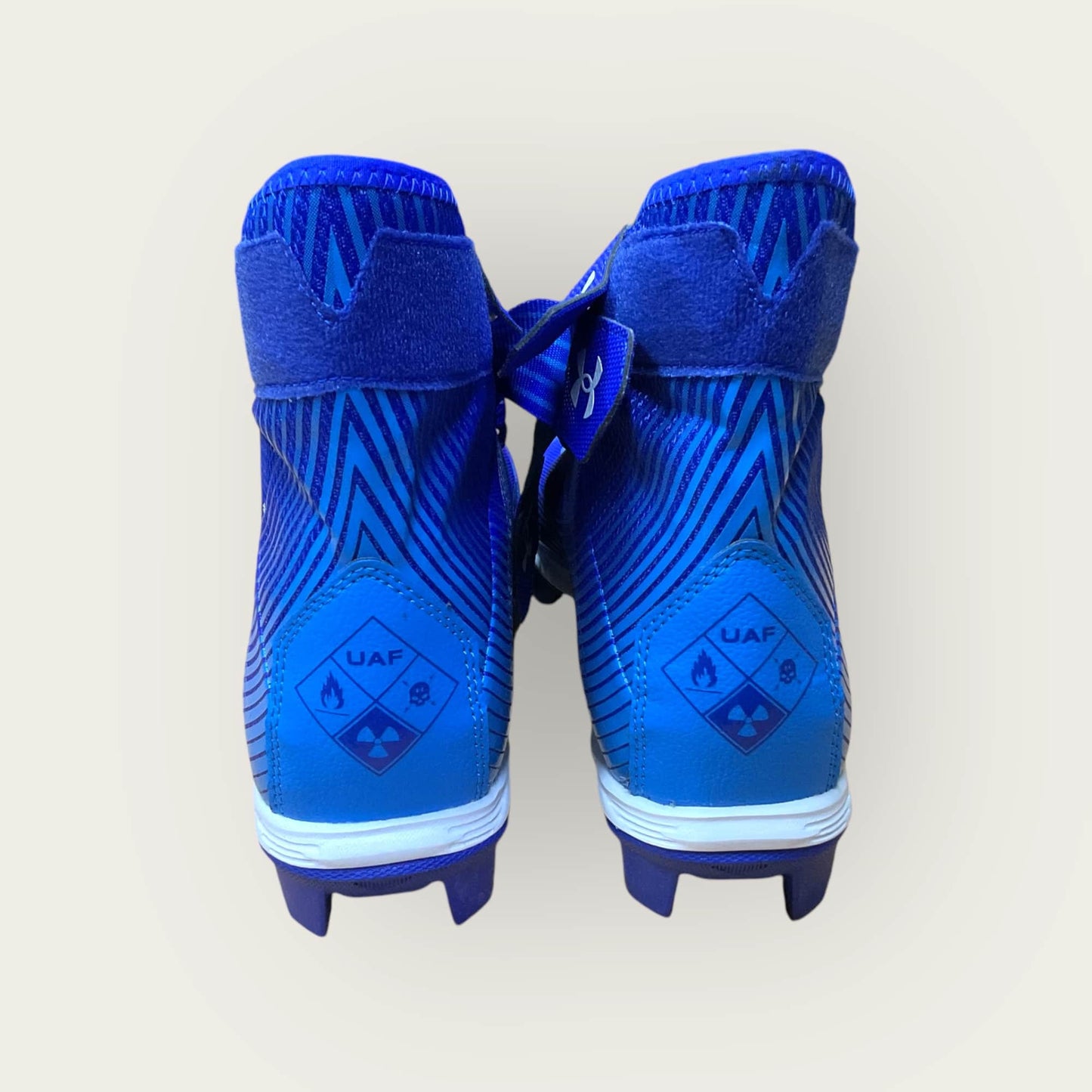 Zapatillas UA Highlight Franchise Azul con tecnología ClutchFit para fútbol y béisbol, en color azul.