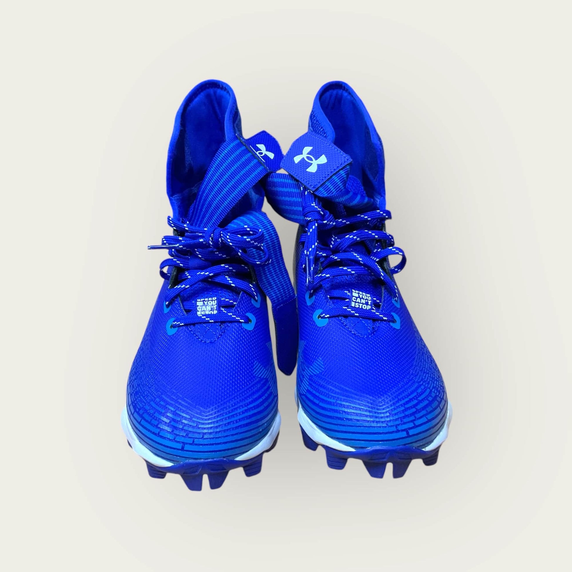 Zapatillas UA Highlight Franchise Azul con tecnología ClutchFit para fútbol y béisbol, en color azul.
