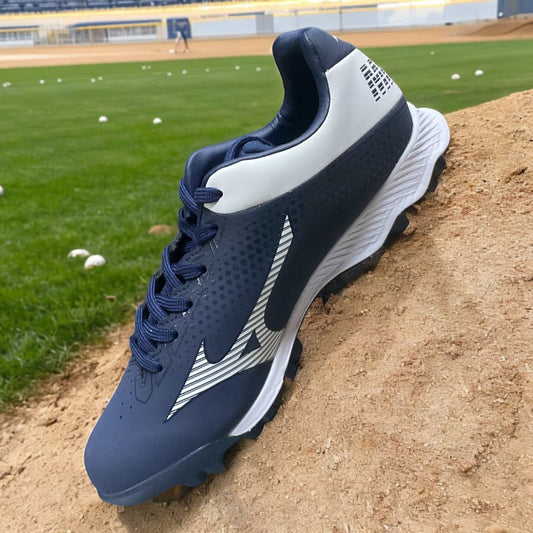 Zapatillas de béisbol Wave Lightrevo Jr en azul, con tecnología Wave para amortiguación y suela de tacos para tracción en el campo